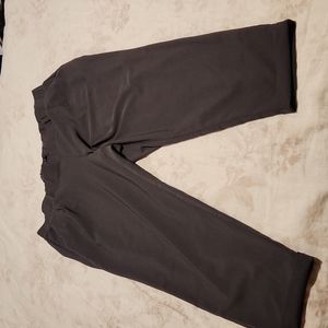 Grey Torrid dress pants size 2 with elastic back and cuffed leg detail.